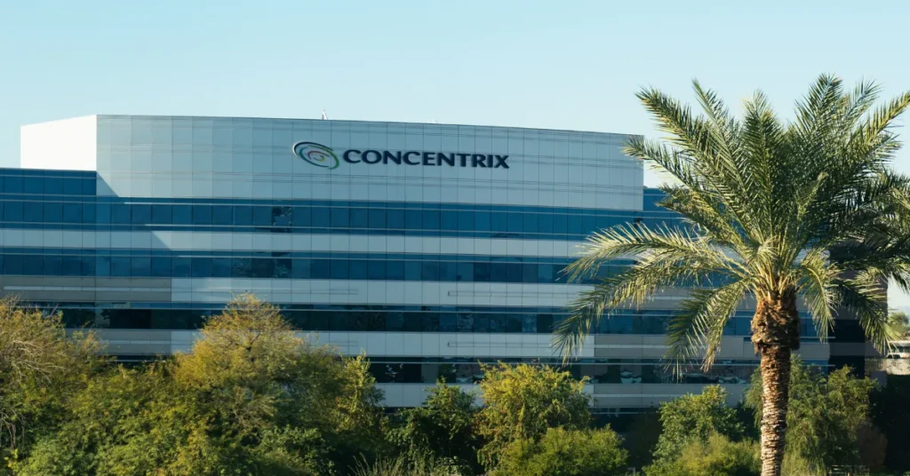 Concentrix office building exterior with company logo and palm tree