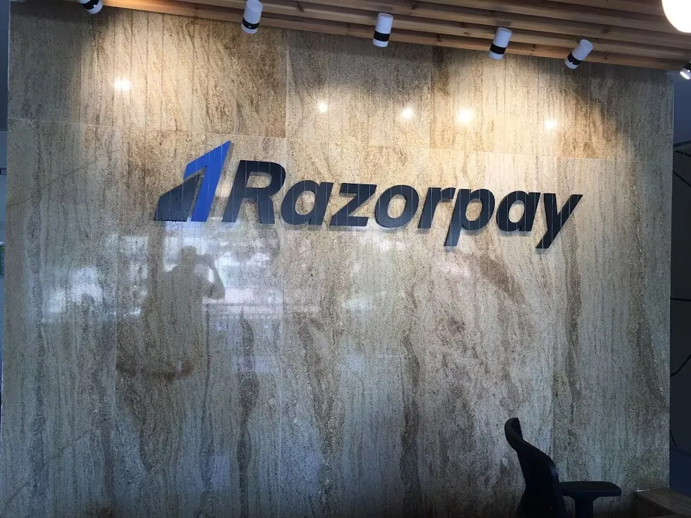 Razorpay office wall logo mounted on marble interior wall