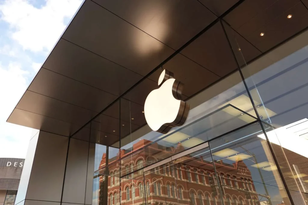 Apple Store exterior featuring the iconic illuminated Apple logo.