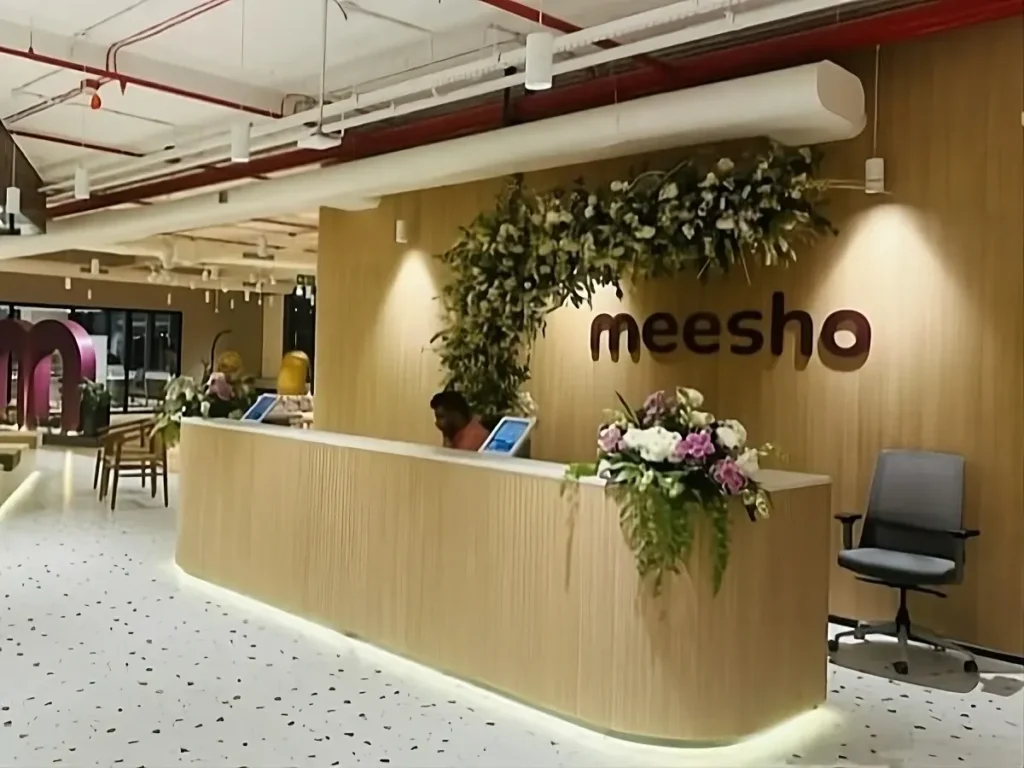 Meesho office reception desk with company logo and modern interior design