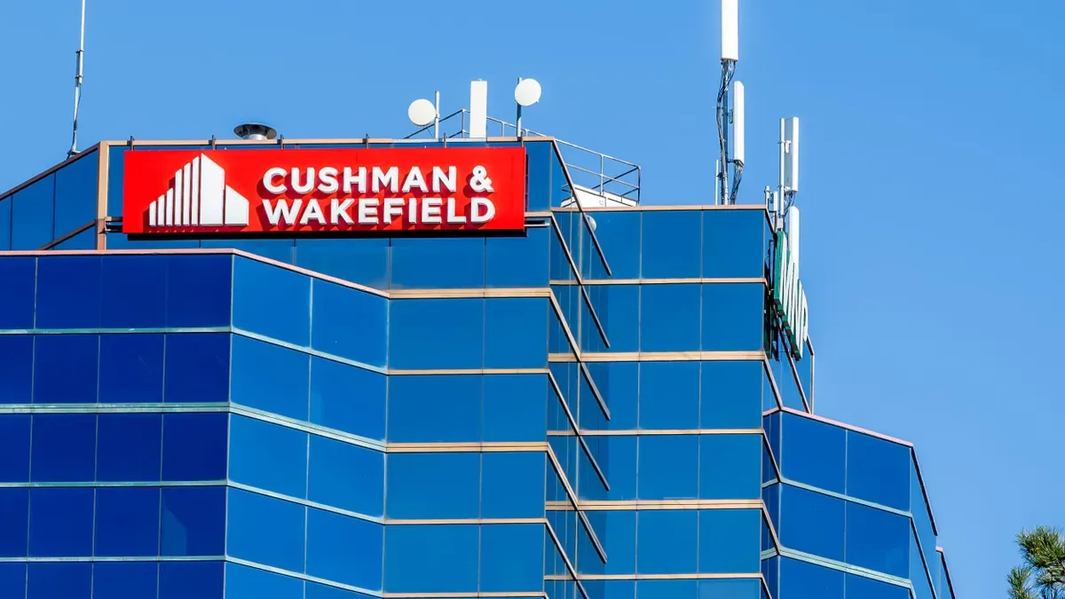 Cushman & Wakefield corporate office building featuring the company logo and branding.